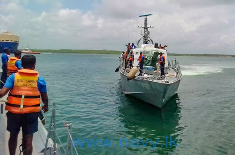 Navy brings ashore 03 distressed fishermen  in a vessel