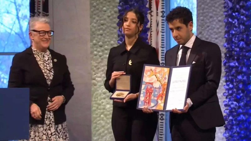 Jailed iranian activist's twins accept her nobel peace prize