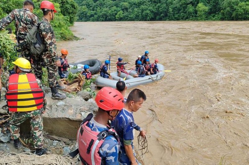 More than 60 missing after 2 buses swept into river in Nepal