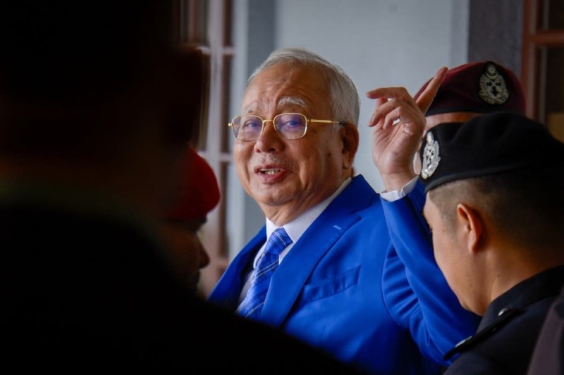 Malaysia king permits ex-PM Razak to serve house arrest