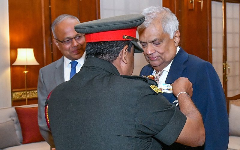 War Heroes Commemoration Flag&rsquo; pinned on President