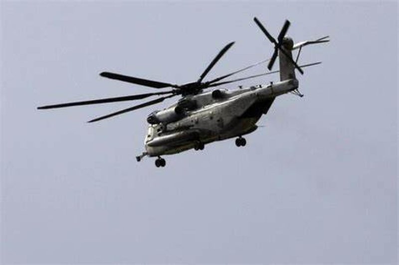 U.S. military helicopter crash lands in Japan rice paddy 