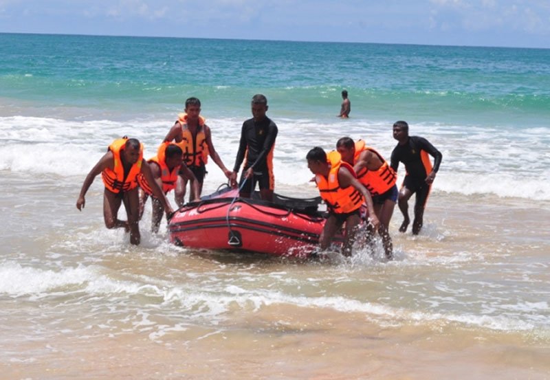 Police lifeguards rescue five persons swept out to sea