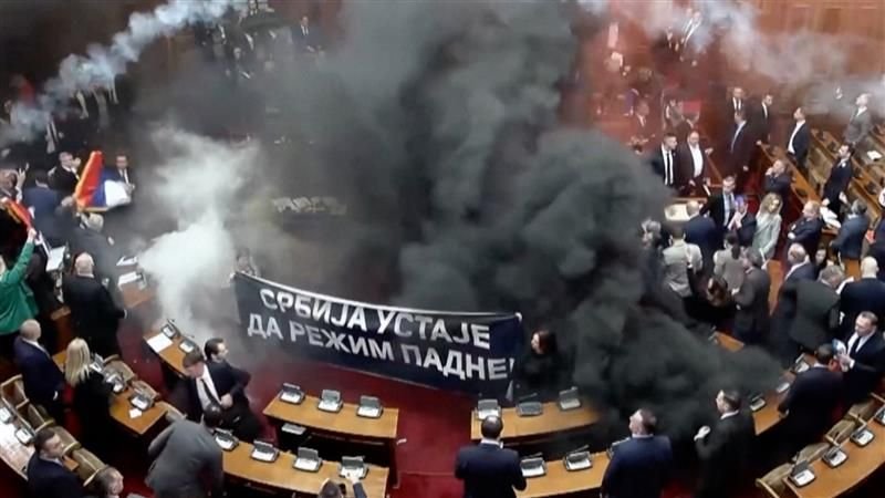 Serbia opposition members throw smoke bombs in Parliment