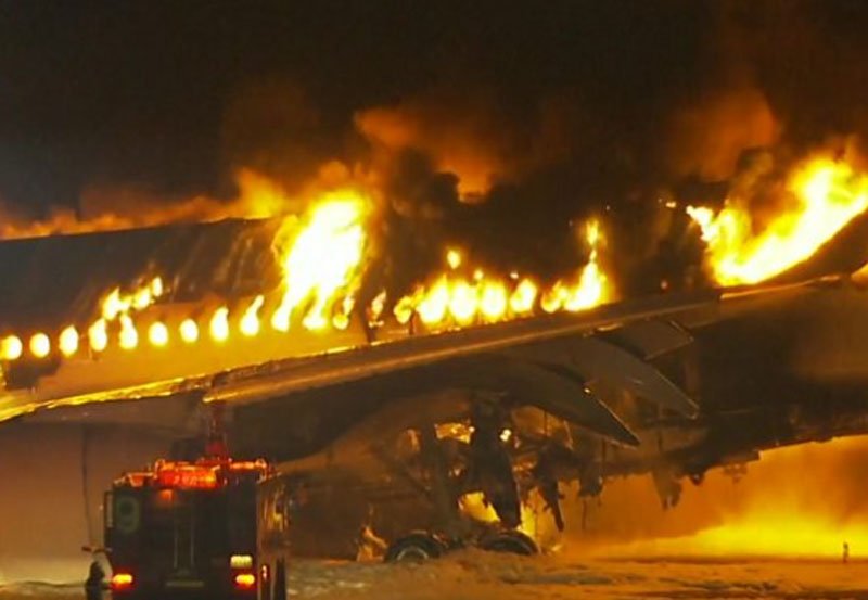 Japan Airlines plane in flames on runway