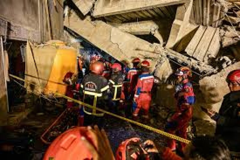 Three dead, dozens trapped after Indonesian school collapses