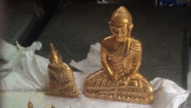 Two arrested in Badulla with ancient Buddha statues and drug